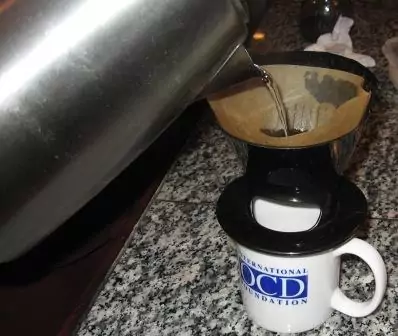 https://totallyuniquelife.com/wp-content/uploads/2013/12/4-Pouring-into-Melitta-Pour-Over-Coffee-Dripper.jpg.webp